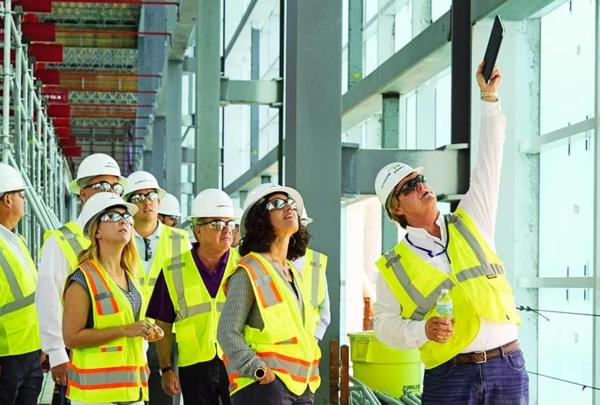 People touring a construction site.